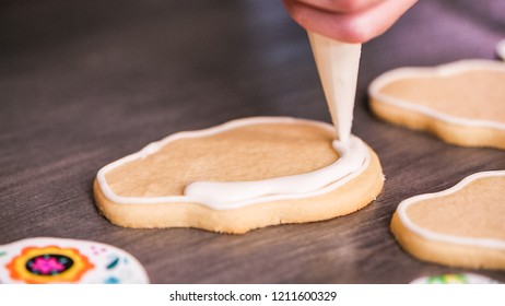 Step By Step. Flooding A Sugar Skull Cookie With White Royal Icing.