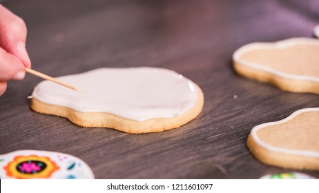 Step By Step. Flooding A Sugar Skull Cookie With White Royal Icing.