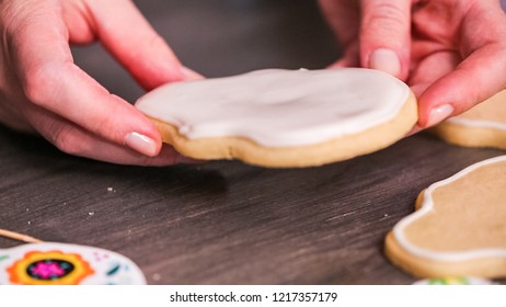 Step By Step. Flooding A Sugar Skull Cookie With White Royal Icing.