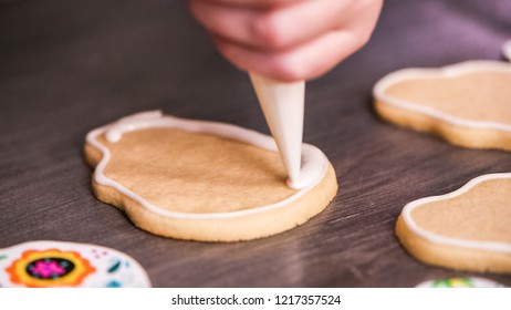 Step By Step. Flooding A Sugar Skull Cookie With White Royal Icing.