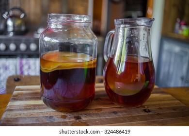 Step By Step How To Make Kombucha Tea, The Brew Is Ready To Be Placed In Storage With The Bacteria Culture In Place To Ferment The Brew.