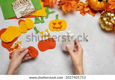 Step by step instruction: how to make a paper pumpkin  garland from colored cardboard or felt. Felt pumpkin for Halloween. Step 6