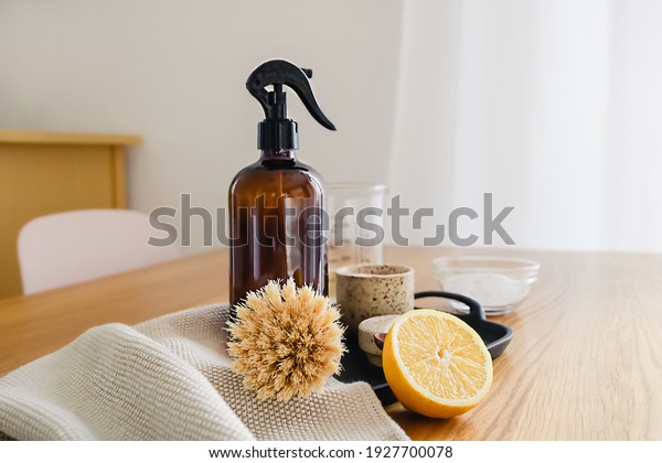 Step by step instruction of non toxic\
home cleaning detergent recipe made of vinegar, baking soda and\
lemon. Eco friendly zero waste household\
concept.