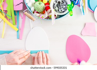 Step by step. Mother and daughter decorating paper Easter eggs. - Shutterstock ID 599035331