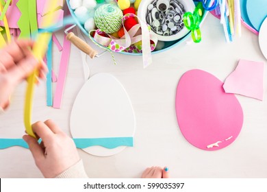 Step by step. Mother and daughter decorating paper Easter eggs. - Shutterstock ID 599035397