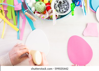 Step by step. Mother and daughter decorating paper Easter eggs. - Shutterstock ID 599035442