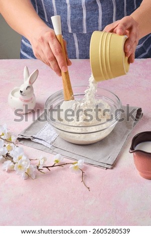 Step by step preparation of Easter cake or other Easter pastries on pink concrete background. Preparation of dough or poolish with yeast. Happy Easter. Step by step recipes