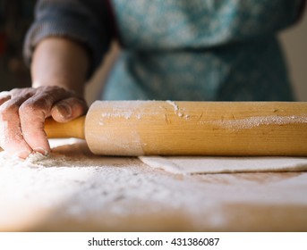 Step by step process of making home-made dumplings or pelmeni with minced meat filling using ravioli mold or maker. Flatten dough with rolling pin - Powered by Shutterstock