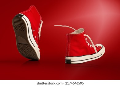 Step by step. Strolling sports shoes on red background. Sneakers or trainers isolated. Athletic shoes. fitness, sport, training concept. Urban fashion. Copy space for ad, text, design - Powered by Shutterstock