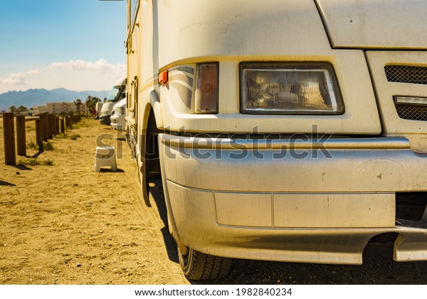 Step at camper car, camping on beach. Travel in\
motorhome, holidays.
