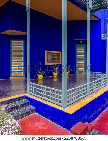 Step into the mesmerizing beauty of the Jardin Majorelle and Yves Saint Laurent Mansion in Marrakech, Morocco. This city photo showcases the stunning blue and green garden filled with vibrant flowers.