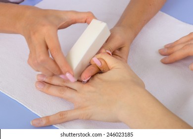 step of manicure process: nail buffing