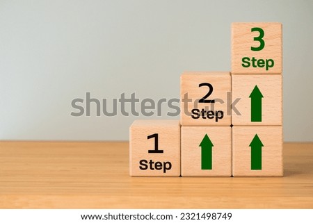 step one second and third, Concept, career and development path, Learning gaining experience, work, achieving success, Wooden blocks with lettering and arrows