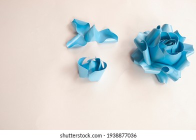 Step To Step, Paper 3 D Flower Make Origami Rose And  Handmade  Romantic Bouquet For Valentine, Wedding, Card, And Decorate Backdrop. Focus Blue Rose Paper On The White Background.