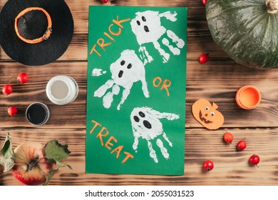 Step  by  step Halloween tutorial ghosts child's handprint  Step 10: Add Trick Treat whatever you like  Top view