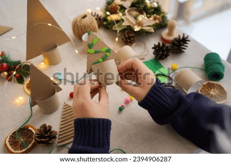 Step-by-step instructions on how to make a Christmas tree out of cardboard. Step 3 Decorate the Christmas tree with colorful balloons. Zero waste concept.