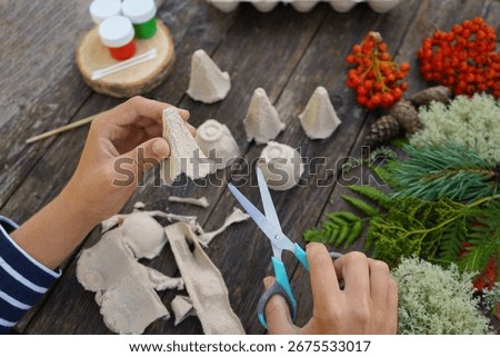 Step-by-step instructions on how to make autumn mushrooms from a cardboard egg carton.