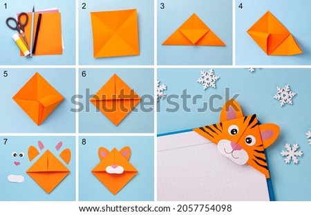 Step-by-step photo instruction on how to make a bookmark in the form of an orange tiger out of paper with your own hands. The symbol of the new year 2022. Simple crafts with children. Origami