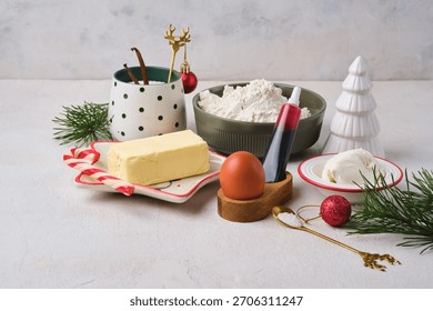 Step-by-step preparation of Candy Cane shortbread cookies in Christmas decor on a light concrete background. Merry Christmas! Traditional Christmas treats