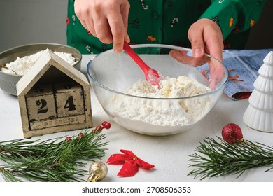 Step-by-step preparation of Candy Cane shortbread cookies in Christmas decor on a light concrete background. Merry Christmas! Traditional Christmas treats