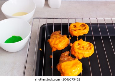 Step-by-step Preparation Of Cottage Cheese Muffins For Halloween. Sweet Cupcakes With Monsters For Kids. Decorating Cupcakes With A Colored Cam. We Paint Pumpkins Orange.