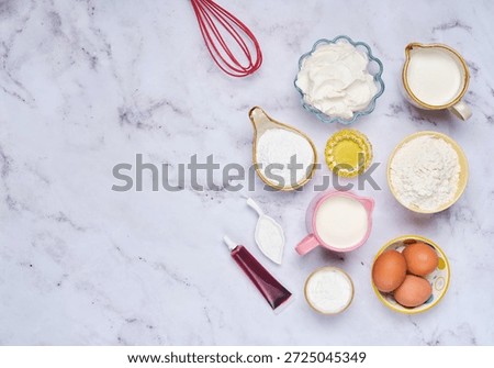 Step-by-step preparation of a roll of thin red pancakes with cream. Prepared ingredients on a light marble background. Step-by-step recipes. International Pancake Day. Maslenitsa.