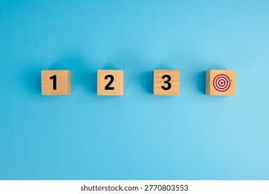 Step-by-step progress and goal achievement concept. Wooden cubes labeled 1, 2, 3 leading to a target icon, symbolizing planning, sequence, strategy, execution, and successful outcomes.