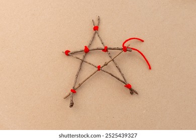 Step-by-step tutorial on making a star-shaped ornament from sticks and red yarn. Craft DIY collage with materials and hands tying knots. Christmas decoration concept,