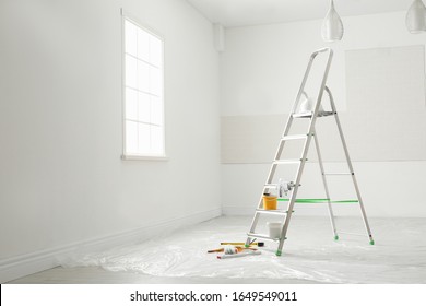 Stepladder And Different Tools In Room. Interior Renovation