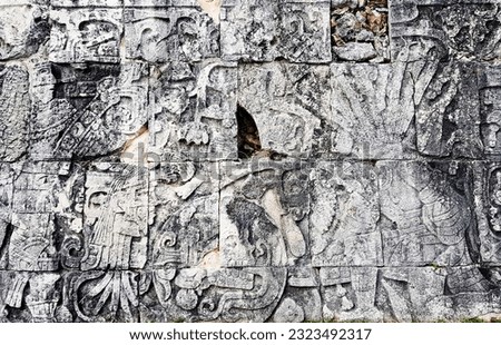 Stepped stone stalls with images of gods in Mayan pyramid structure in Yucatan