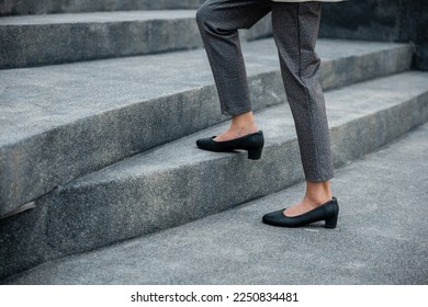 Stepping going up stairs in city, Closeup legs of businesswoman hurry up walking on stairway, rush hour to work in office a hurry in morning, foot of business woman wear black shoes step up success - Powered by Shutterstock