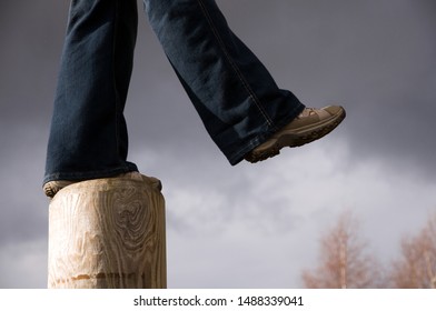 stepping off into a void with a grey sky
