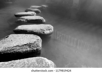 Stepping Stones Path Over A Pond