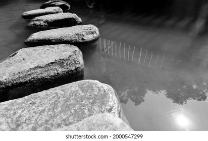 Stepping Stones Path Over A Pond