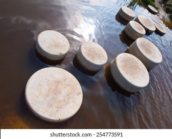 Stepping Stones In Water Of A Pond