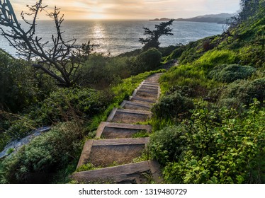 Steps down to the beach during sunset.