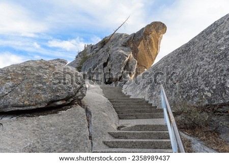 Steps leading up a rocky mountaintop on a sunny autumn day