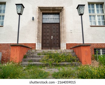 Steps Overgrown With Grass. Overgrown Building Entrance.