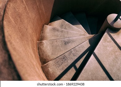 steps of an spiral stair. Modern spiral staircase made in metal that look like old and rusty . Downward winding staricase in old steel.  