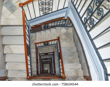 Steps of stairs and railings in an ancient building