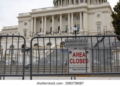 Steps to US capitol building closed off with riot fence and area closed sign.  No visible people - Shutterstock ID 2083738087
