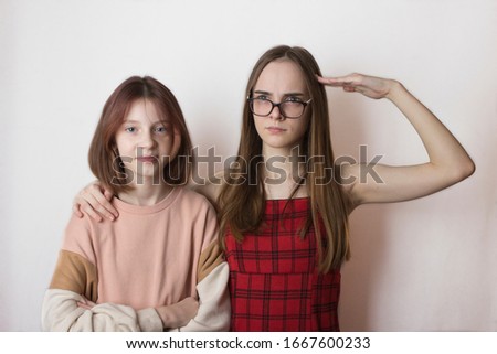 stepsisters or friends children teens not like each other on a white background
