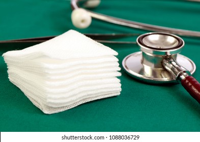 Sterile Gauze On Green Operation Cloth.