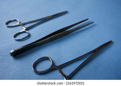 Sterile Medical Instruments Close-up On A Blue Background.