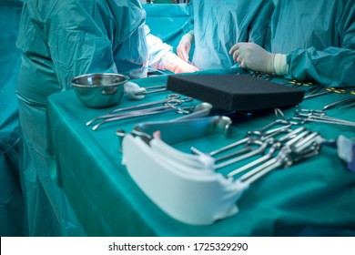 Sterile Surgical Instruments Are On A Table During An Operation