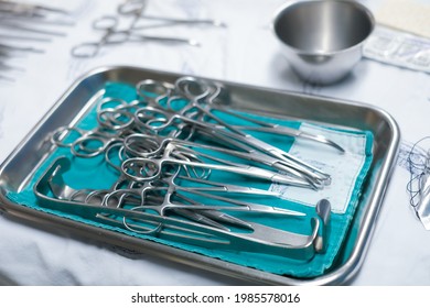 sterile surgical instruments are on a table during an operation. Medical instruments in a steel tray.