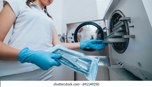 Sterilizing Medical Instruments In Autoclave. Dental Office