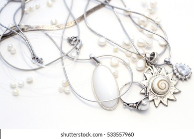 Sterling Silver Jewelry On A White Background, Pearls