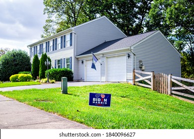 Sterling, USA - September 15, 2020: Presidential Election Political Yard Lawn Sign Poster For Joe Biden Harris 2020 Text In Northern Virginia Suburbs With Brick House Exterior