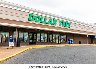 Sterling, USA - September 9, 2020: Storefront Sign At Strip Mall Plaza With People Man Person In Mask Walking By Entrance To Dollar Tree During Covid-19